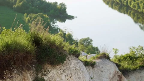 Spring landscape. Top view of river surrounded by a green forest and meadow. 4K Vidéo 93260953