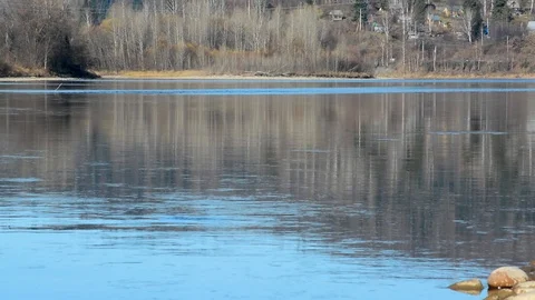 Spring landscape view of the river and mountains against the sky and houses Stock Footage 102481147