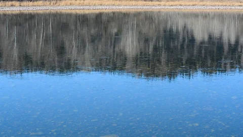 Spring landscape view of the river and mountains against the sky and houses Video stock 107088872
