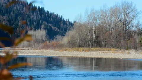 Spring landscape view of the river and mountains against the sky and houses Stock Footage 107089080