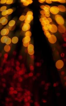 Spring light bokeh on black background Stock Photos