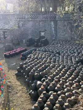 Spring Light on Wine Jars in the Courtyard of Sima Small Shochu Brewery Stock Photos