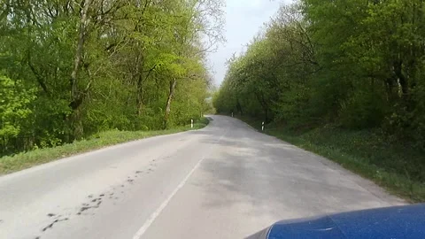 Spring local road ride across forested upland area of Myjava region Stock Footage 334511022