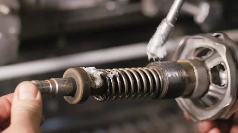 Spring lubrication with solid oil, grease, gun fat-plastic preservation grease Stock Footage 150456005