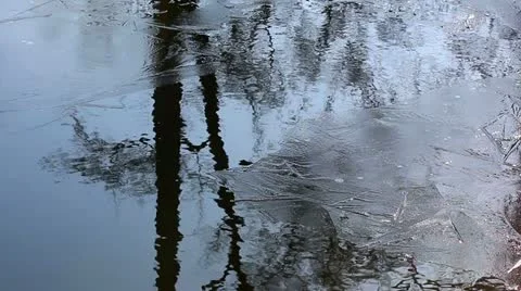 Spring melting of ice on a pond Stock Footage 21908277