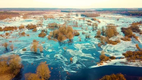 Spring melting river flood. Sunset over meadows. Streaming water. Drone view Stock Footage 88102863