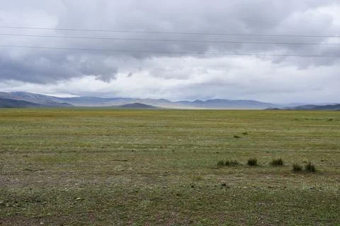 Spring Mongolian steppes in overcast weather. Stock Photos