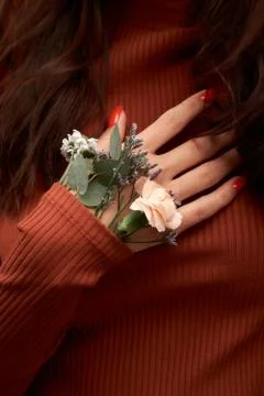 Spring mood. Hand and spring color flower Stock Photos