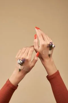 Spring mood. Hand and spring color flower Stock Photos