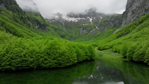 Spring mountain valley, lake on a foreground Video stock 249999693