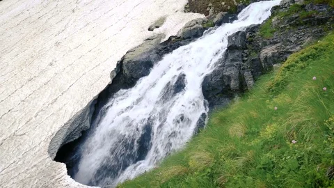 Spring Mountain Waterfall flowing Under Ice. Melting of the glacier Vídeos de archivo 71196543
