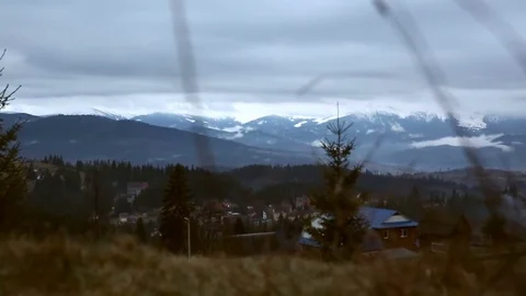 Spring in the mountains, partly snow. Snow, clouds and mountains. Evening clouds Stock Footage 77006774