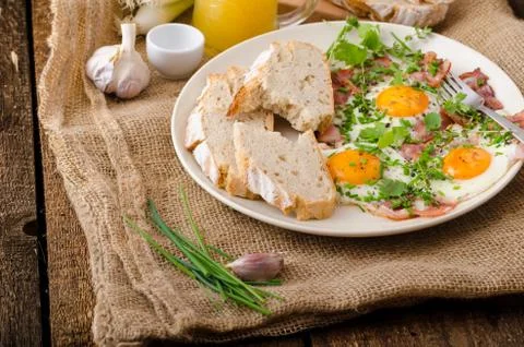 Spring omelette with bacon, egg and herbs Stock Photos