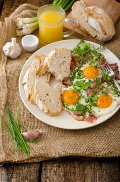 Spring omelette with bacon, egg and herbs Stock Photos
