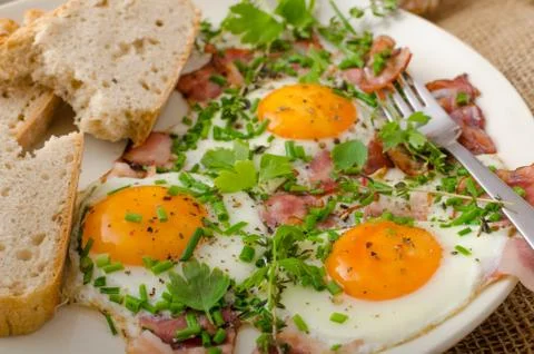 Spring omelette with bacon, egg and herbs Stock Photos