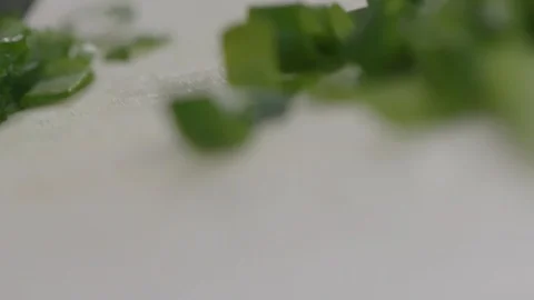 Spring onion cut in slow motion Stock Footage 116897985