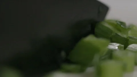 Spring onion cut in slow motion Stock Footage 116898058