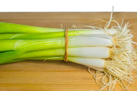 Spring onion on a plank Stock Photos