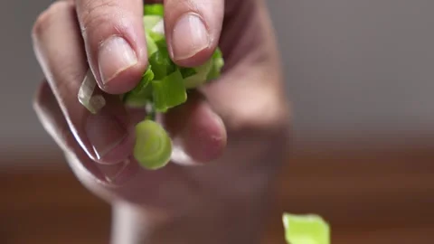 Spring onions drop in slow motion where fresh food is the devotion Video stock 324958215