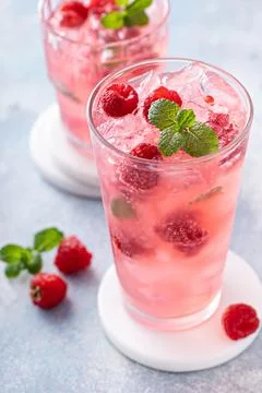 Spring or summer cocktail with raspberry and mint Stock Photos