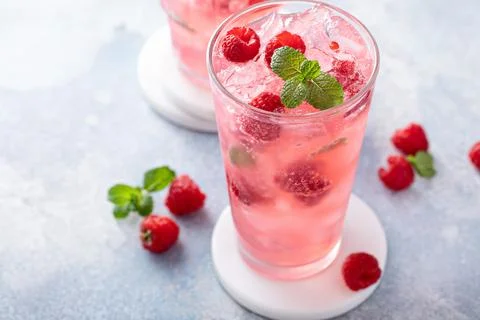 Spring or summer cocktail with raspberry and mint Stock Photos