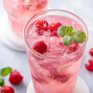 Spring or summer cocktail with raspberry and mint Stock Photos