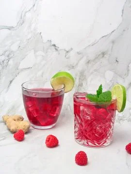 Spring or summer cold mocktail, raspberry lemonade and lime Stock Photos