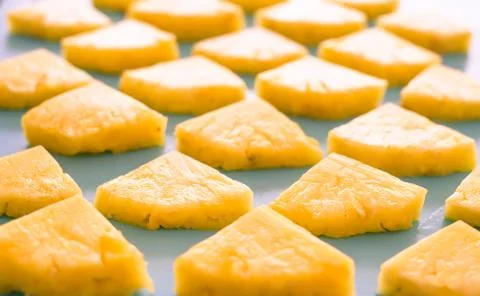 Spring or summer concept : Close up patter of many pieces of yellow pineapple Stock Photos