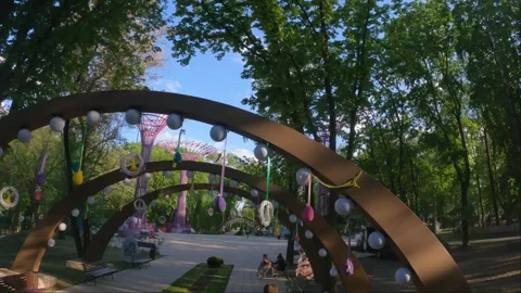 Spring park decorated for Easter bright eggs flowers and baskets adorn the Stock Footage 310935283