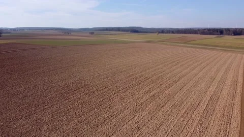 Spring, plowed field next to the forest Stock Footage 172057433