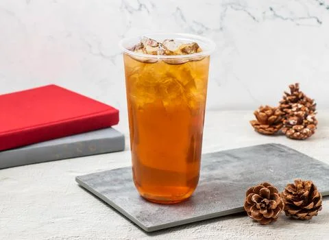 Spring Plum and Winter Melon iced tea served in disposable glass isolated o.. Foto stock