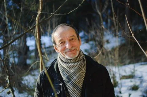 The spring portrait of elderly man with a gray beard Stock Photos