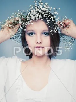 Spring portrait girl with wreath of flowers Stock Photos