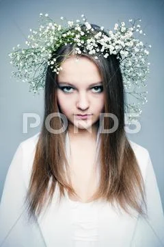 Spring portrait girl with wreath of flowers Stock Photos