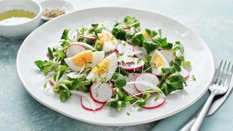 Spring radish and eggs salad. Fresh Easter salad Stock Footage 269828234