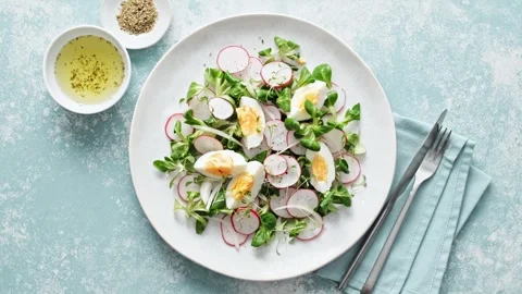 Spring radish and eggs salad. Fresh Easter salad Stock Footage 269828242