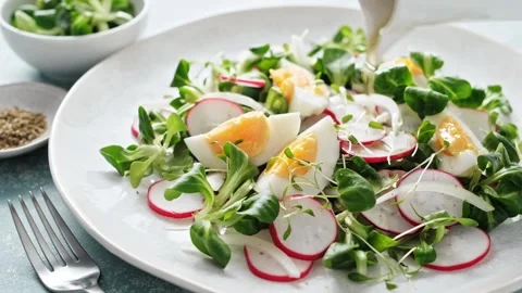 Spring radish and eggs salad. Fresh Easter salad Stock Footage 269828300