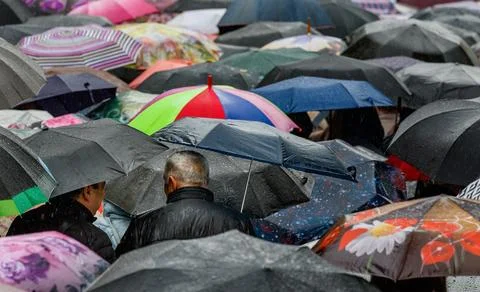 Spring rain in a crowded city Stock Photos