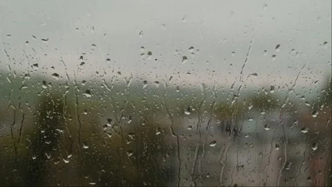 Spring rain, droplets running down window glass, showcases waterproofing and ins Stock Footage 276183017