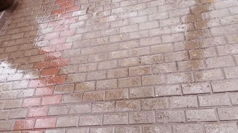 Spring rain on a stone pavement Stock Footage 106947155