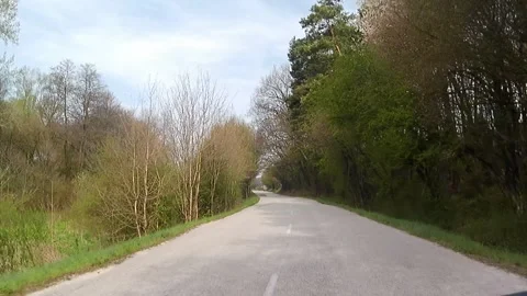 Spring ride on rough local asphalt road, uplands of Myjava region 動画素材 334511110