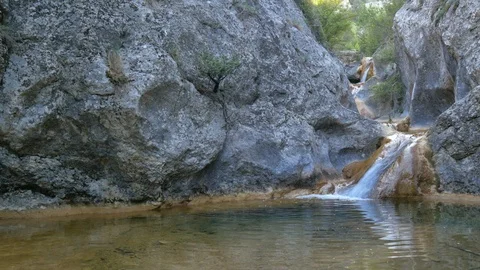 Spring rill flow and cave rock Video stock 89872401