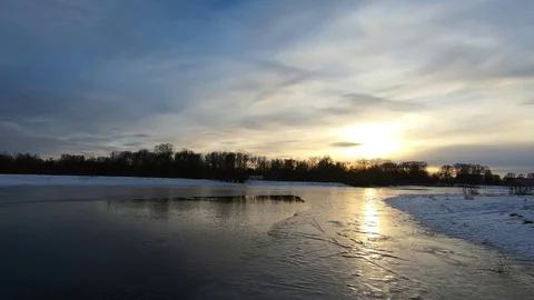 Spring river and melting ice on the background of the sunset Stock Footage 87553387
