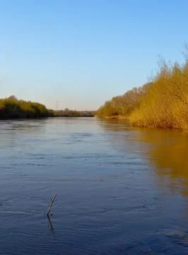 Spring river channel Stock Photos