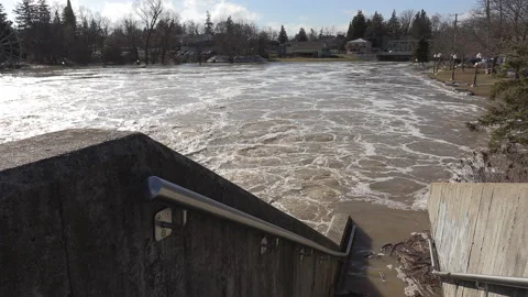 Spring river flooding during record warm temperatures in Ontario Canada Stock-Footage 150296998