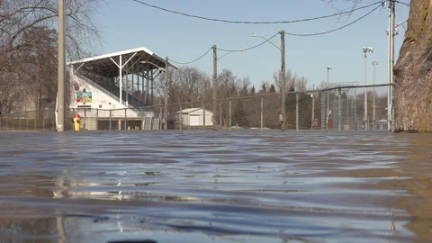 Spring river flooding during record warm temperatures in Ontario Canada Stock Footage 150298053