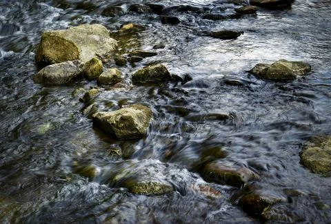 Spring river with large stones Stock Photos