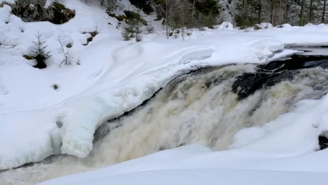 Spring river streams from under ice and snow close view Stock-Footage 108547143