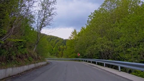 Spring road in mountains Stock Footage 76004202