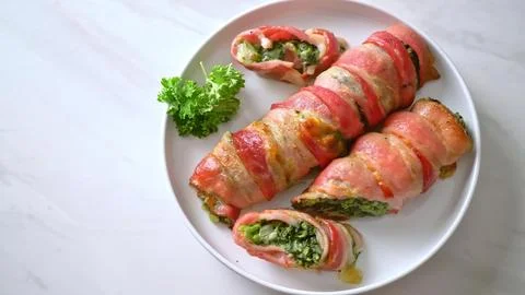 Spring roll appetizer with vegetables and herbs on white plate Stock Photos